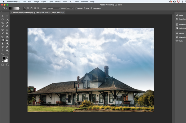 Use the gradient tool to apply a Photoshop sky overlay