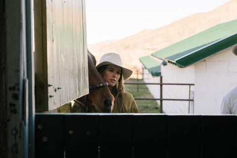 Designer, Madison McKinley Isner with her horse at the Steerhead Ranch. 