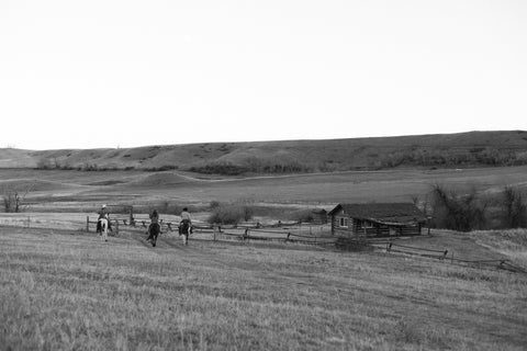 Madison McKinley team riding into dusk on the Steerhead Ranch.