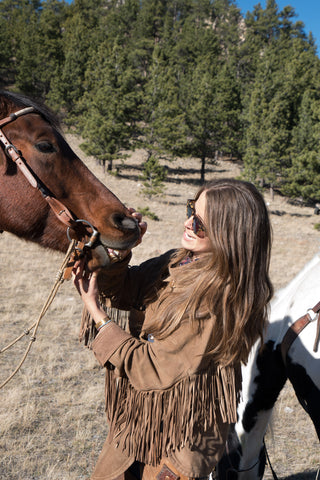 Madison McKinley on the ranch with her horse. 