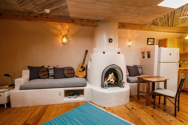 Santa Fe Pueblo Style Tiny Home Interior - Kiva Fireplace
