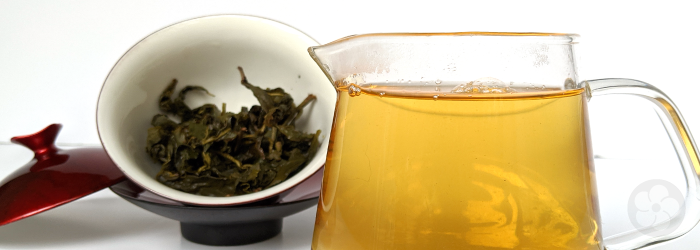 large pitcher of tea, filled with several infusions from a single serving of leaves in a small gaiwan