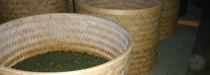 These bamboo baskets full of tea are placed over charcoal pits for gentle roasting