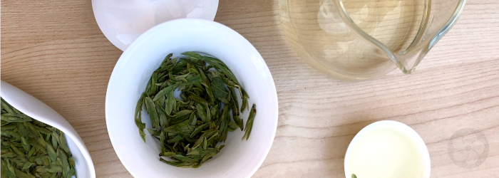 Green teas like this one in a white gaiwan can be among the highest in caffeine.