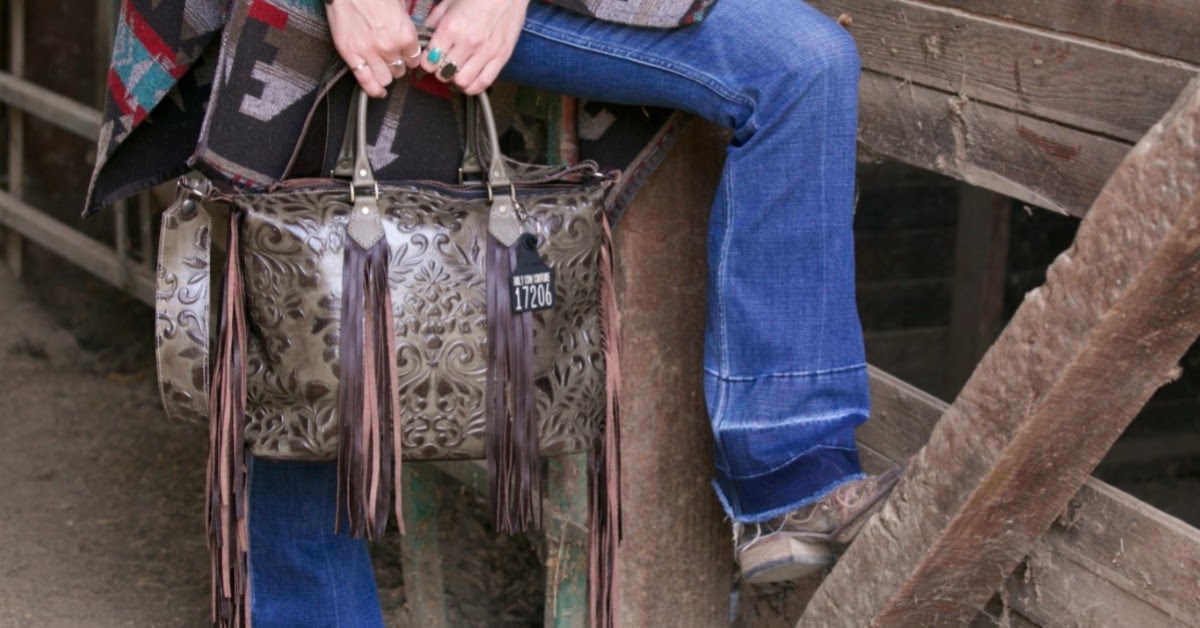 boot cut jeans with cowhide bag