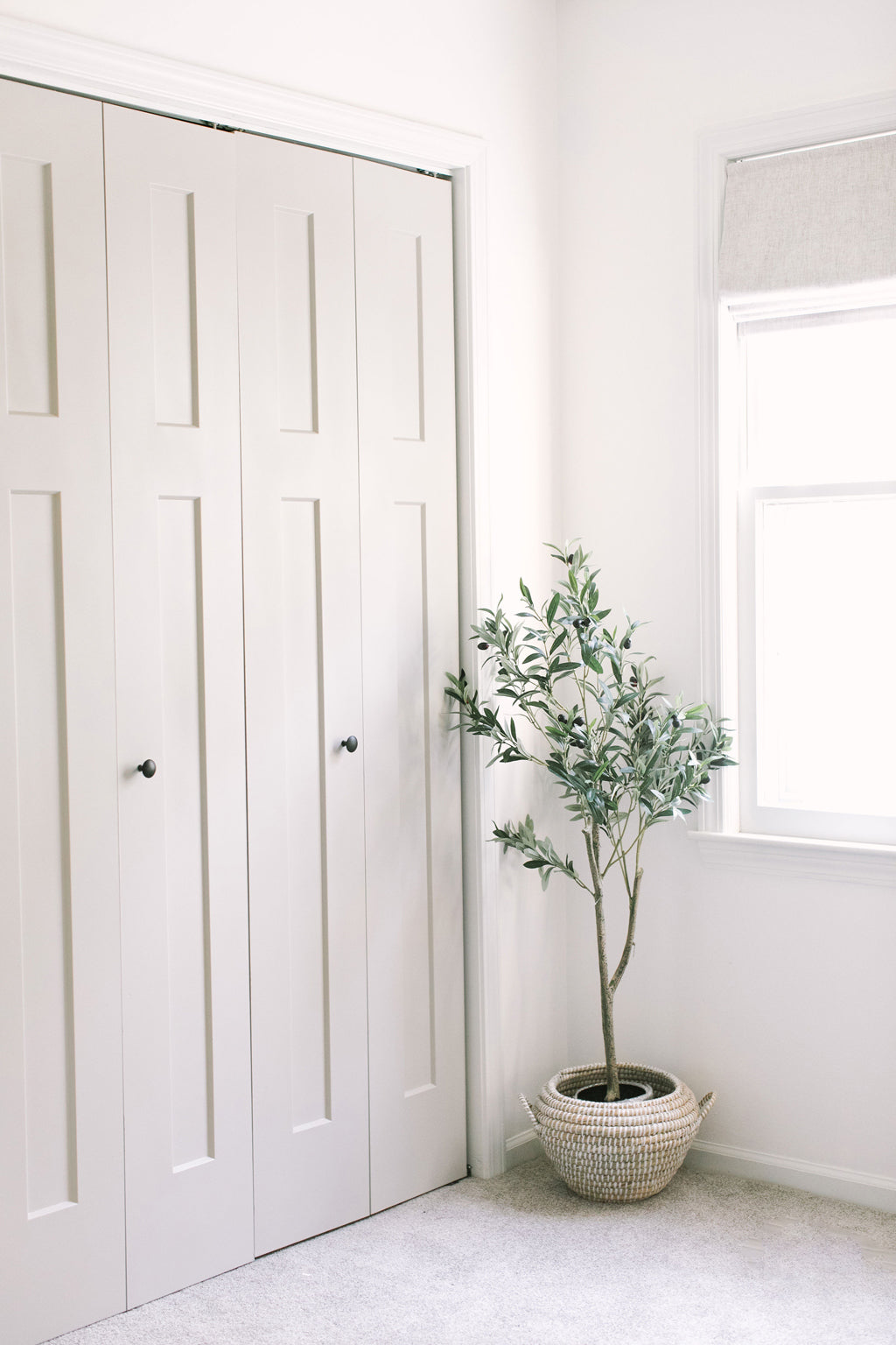 Minimal gender neutral nursery closet design