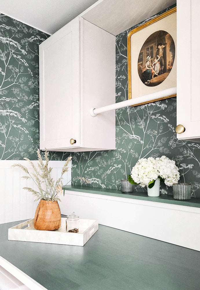 Modern laundry room interior styled with dark green wildflower removable wallpaper