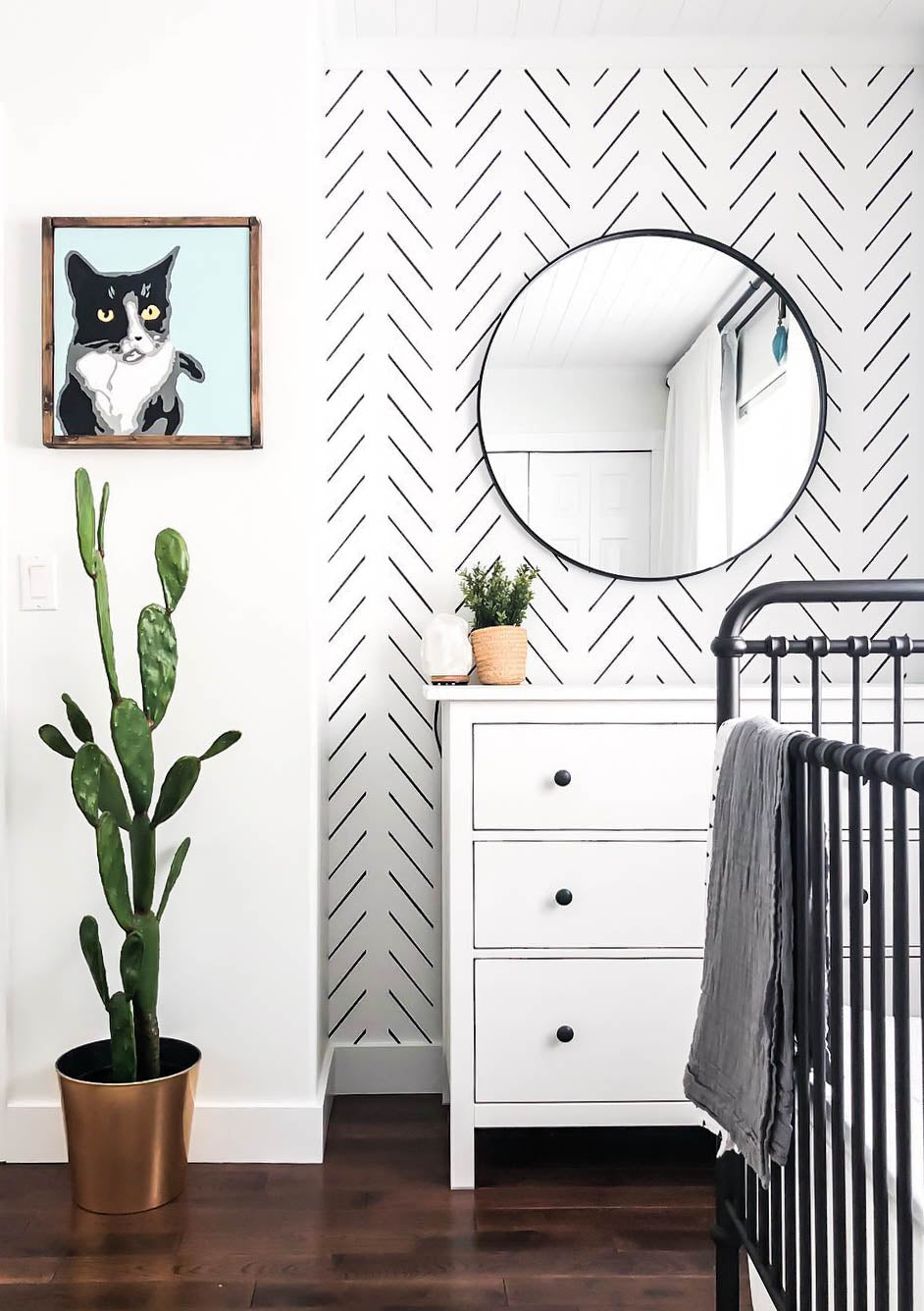 Modern Apartment Therapy inspired baby nursery with minimal design geometric herringbone wallpaper