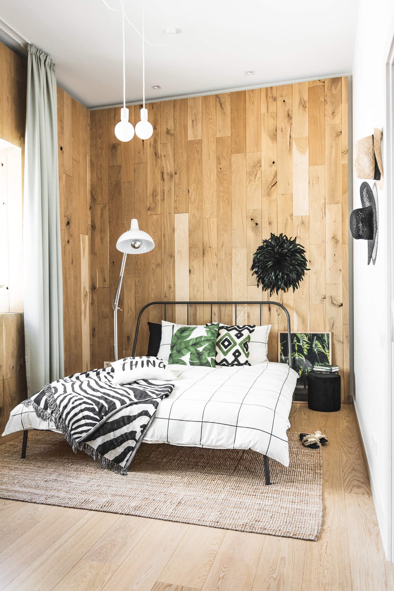 Modern minimal safari inspired boho bedroom interior. Neutral color palette bohemian bedroom interior with boho interior decor.