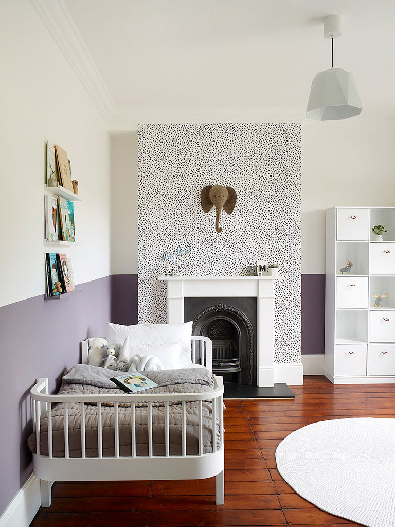 Minimal eclectic kids room with dalmatian print removable wallpaper and animal decor