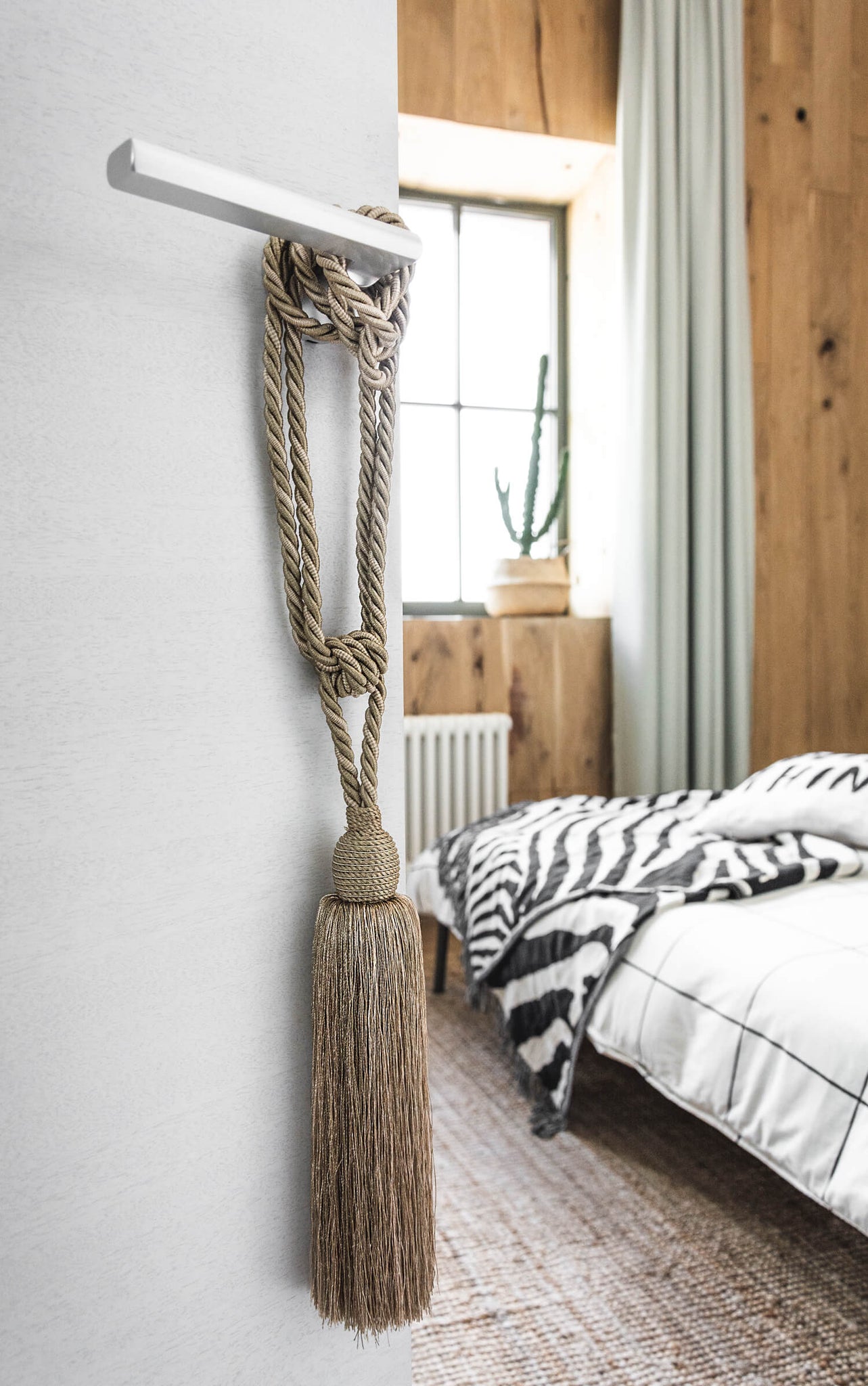 Boho bedroom decor, golden tassel on door knob