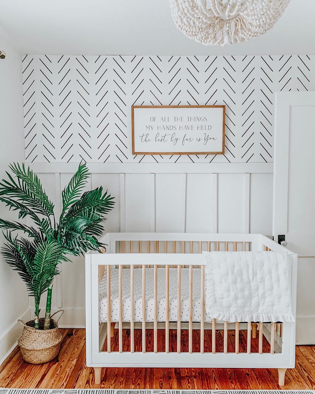 Mid century modern nursery with graphic wallpaper