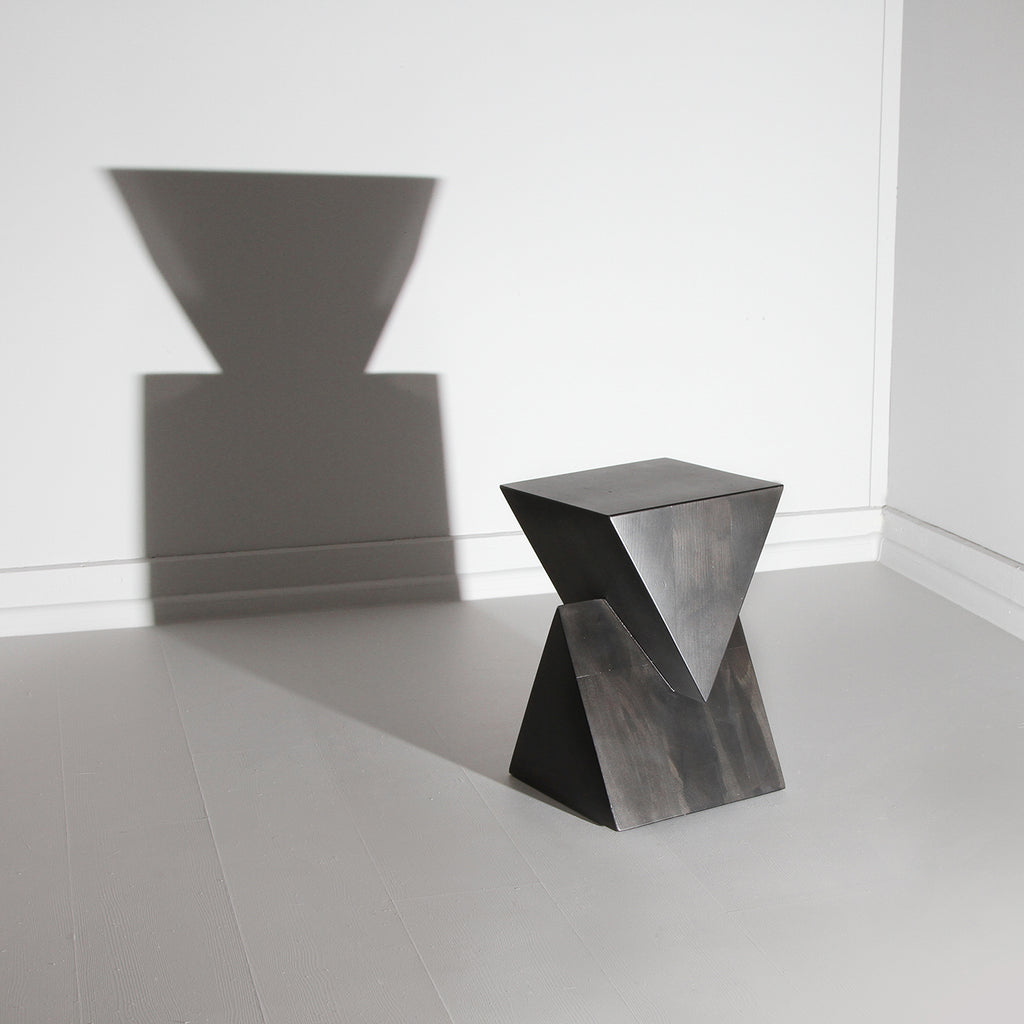 Minimal design bedside table design. Black geometric wooden stool design.