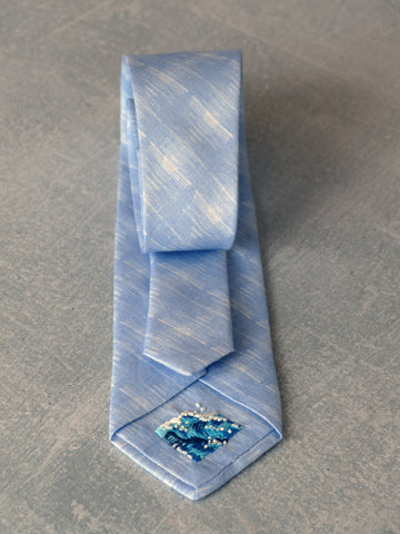 Prufrock linen tie by Niki Fulton with bespoke Wild Sea embroidery by Flora Collingwood-Norris
