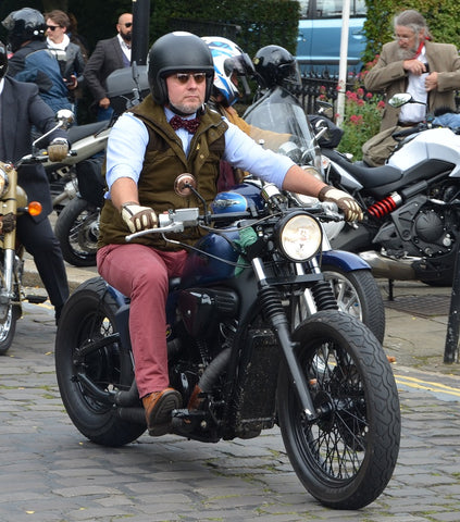 man in pink jeans on a Harley Davidson at Manchester Distinguished Gentlemans Ride