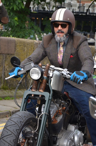The beard, the attitude, the mean bike, the sky blue gloves..?