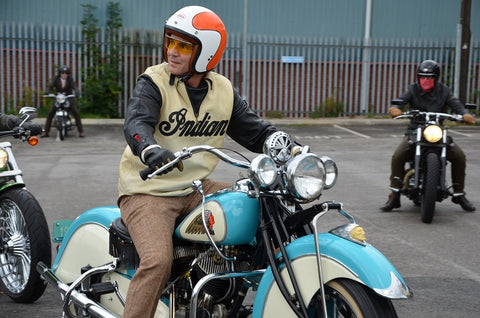 Distinguished gentlemans rider on a blue & white Indian with Indian pullover