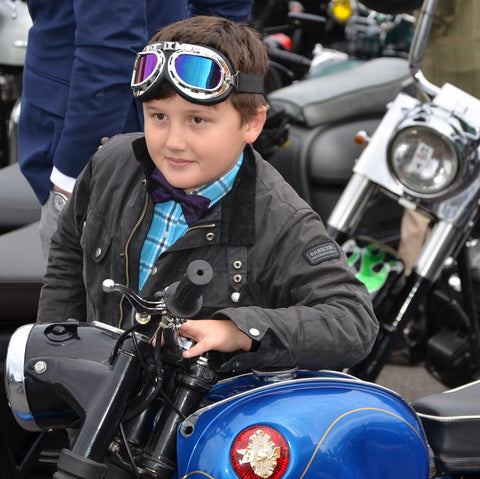 young boy in aviator goggles on a BSA Manchester Gentlemans Ride