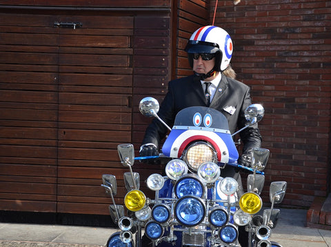 stylish gent on a lambretta bedecked with mirrors at Manchester Gentlemans Ride