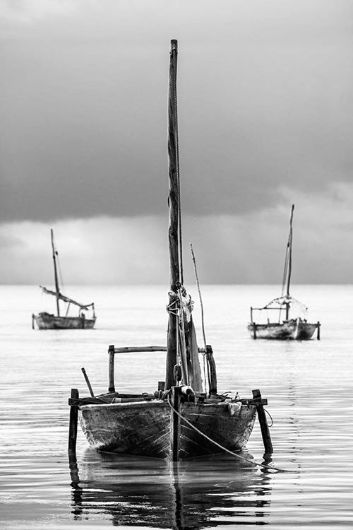 David Ballam wall art featuring fishing sail boats in Zanzibar. Available at Sarza home goods and furniture store Rye New York