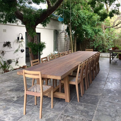 James Mudge outdoor dining table and chairs. The solid wood furniture is available at Sarza home goods, furniture & décor store in Rye