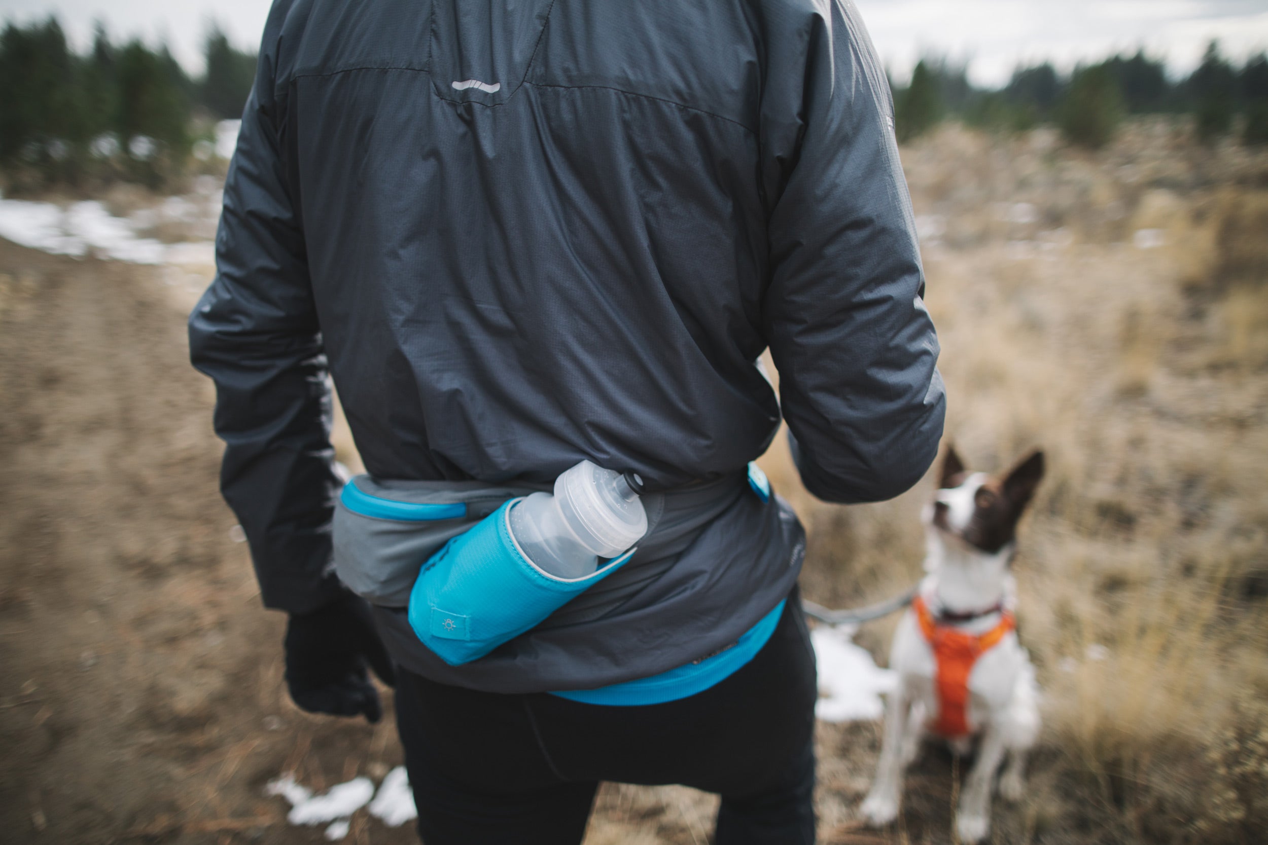 When out on a run with Jake, Timothy carries his essentials — keys, cell phone, snacks — in the Trail Runner Belt, part of Ruffwear's new Trail Runner System.