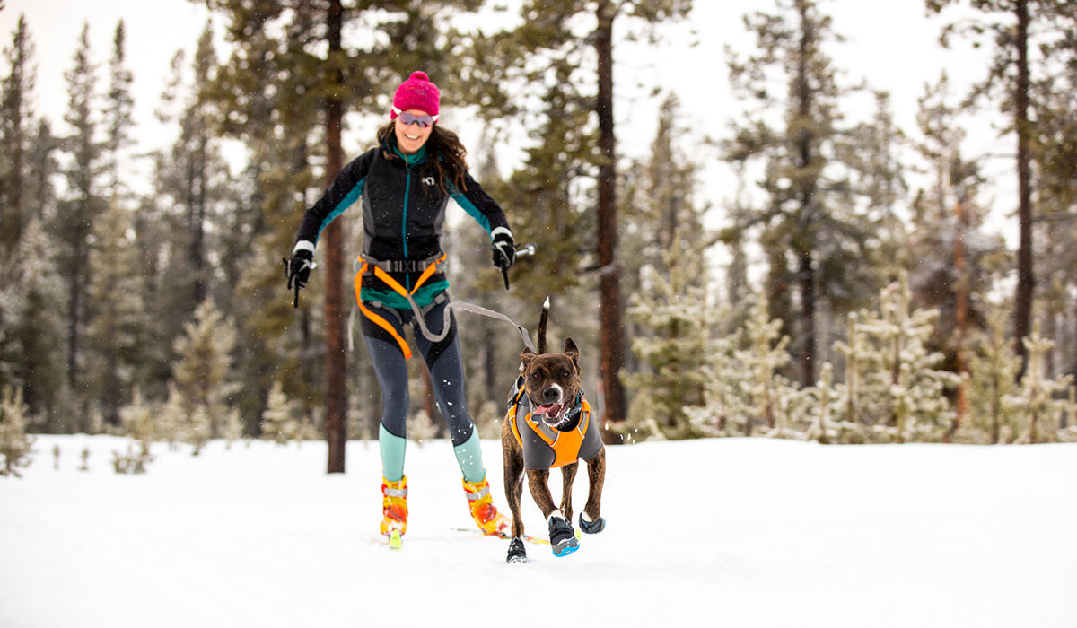Kelly Ruffwear Sustainability Coordinator skijoring with dog Juniper.