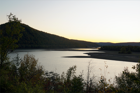 Sunset over river and hills in Virginia.