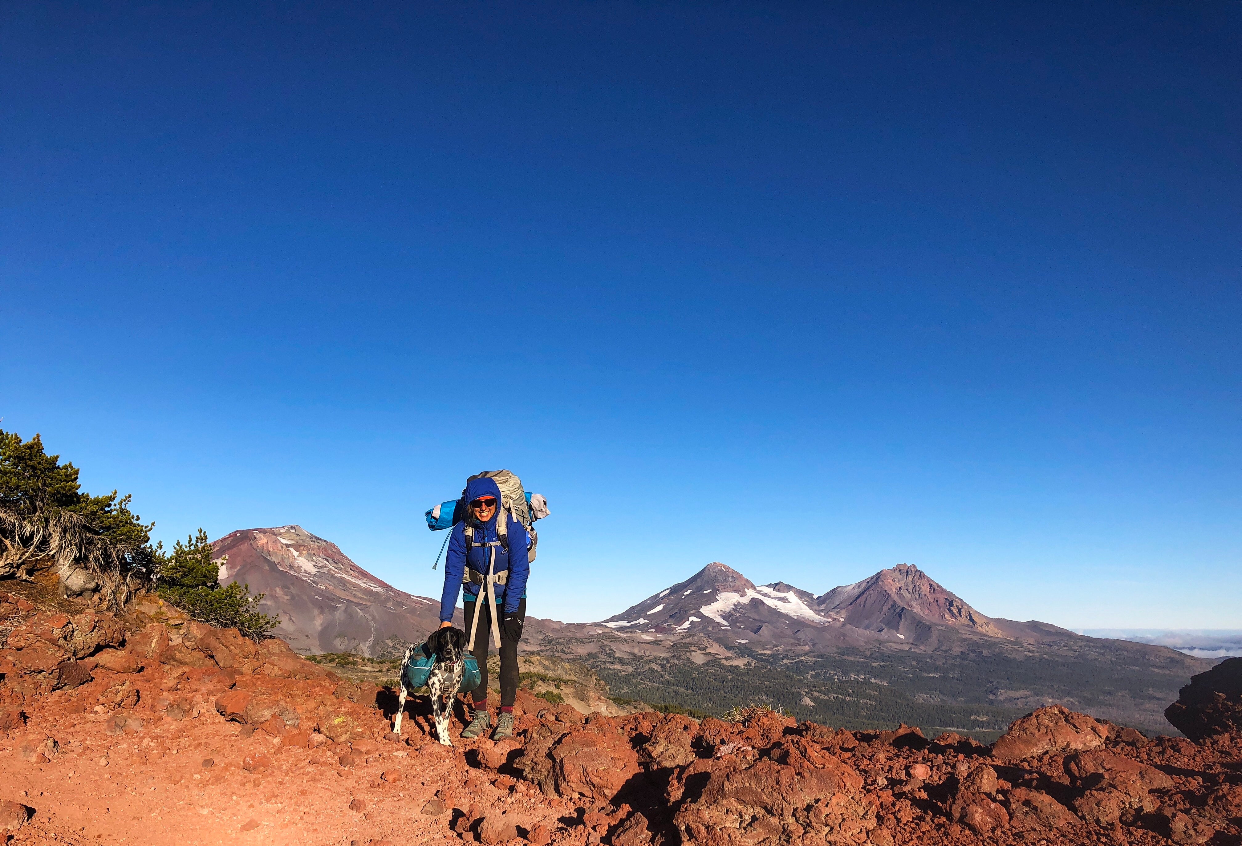 Dani with backpack and Vilas in Approach Pack on central oregon backpacking trip.