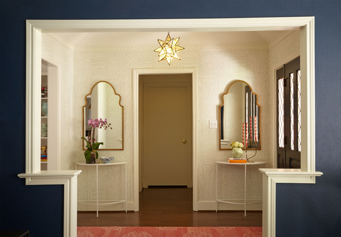 wallpapered entryway with two mirrors - interior designer Maddie Hughes