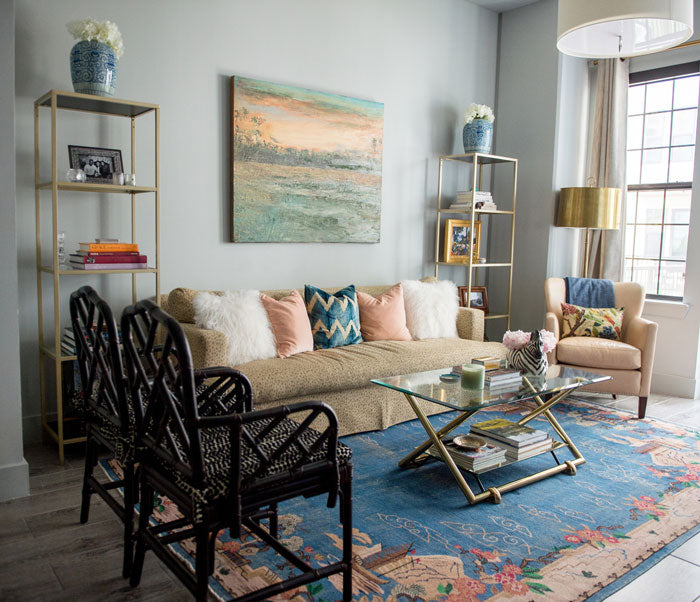 living room with blush blue and white designer pillows - interior designer Maddie Hughes