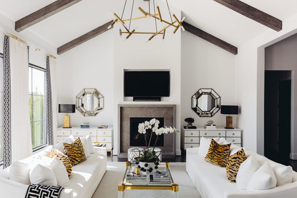 black and white chic living room with animal print pillows by Paloma Contreras
