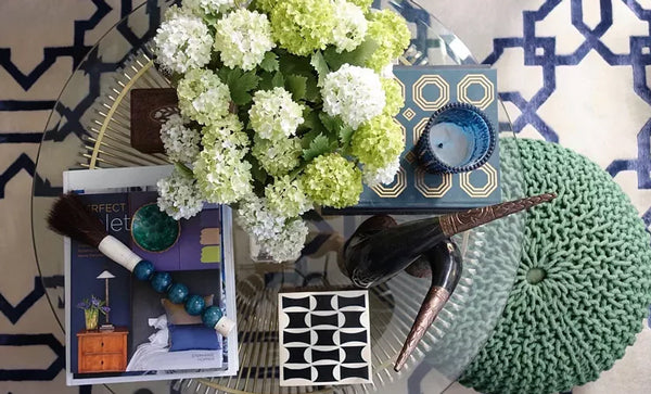 blue and green coffee table styling details with white hydrangeas | Designer Spotlight: Meredith Heron | Arianna Belle Blog