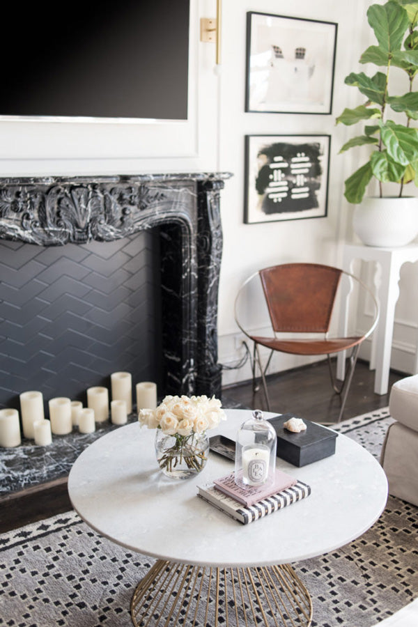 interior designer Shannon Claire Smith | black fireplace leather chair round coffee table | Designer Spotlight series Arianna Belle Blog