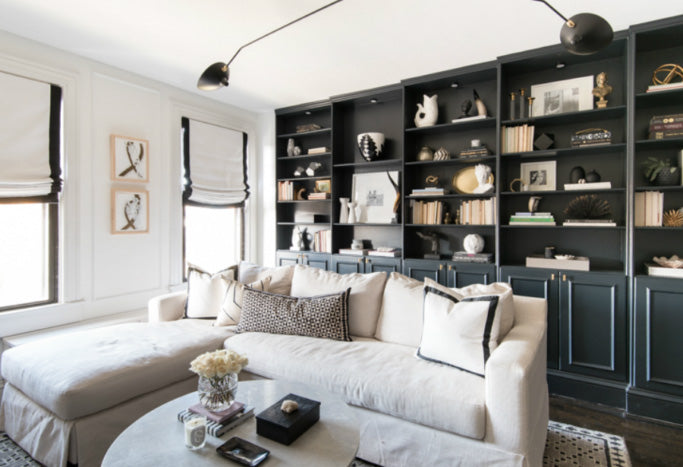 interior designer Shannon Claire Smith | black and white living room with sectional and pillows