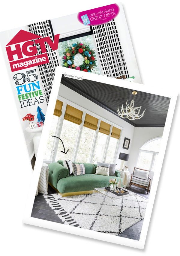 Modern black white and green living room designed by Nicole Botsman with white solid pillow with black border from Arianna Belle as seen in HGTV magazine
