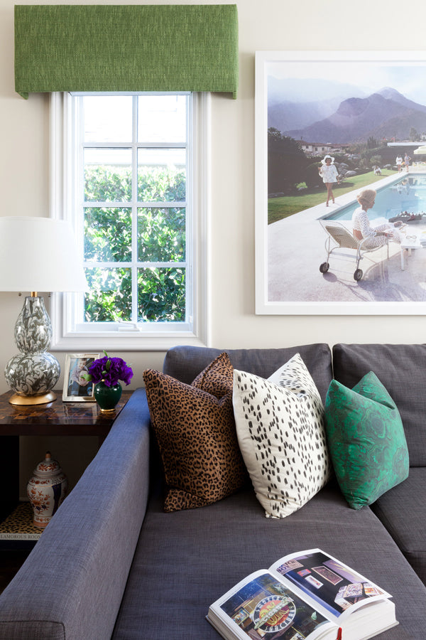 Designer Spotlight: Jenn Feldman | grey sectional sofa with leopard pillow les touches black pillow and green malachite pillow