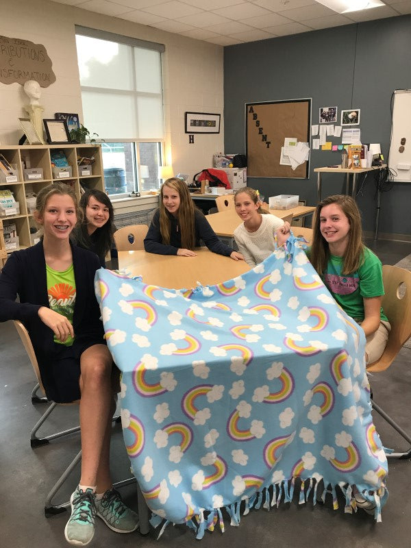 Isabella and her NJHS friends making fleece blankets