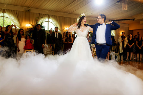Henkaa A Bride's Story: Diana & Jas. Husband and wife share first dance with smokey dance floor.