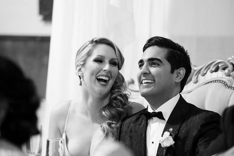 Stephanie Rochefort and Subhir Uppal laugh together at their multicultural wedding at allsaints Event Space located in Ottawa Ontario, Canada