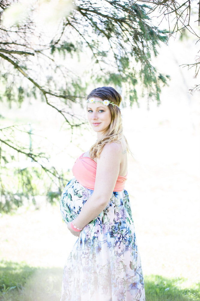 5 Mother's Day outfit ideas: blonde pregnant woman wearing a flower girdle and a Henkaa convertible overlay.