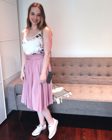 Kate Maranduik wearing the Henkaa Sakura Midi in Dusty Rose as a skirt with a floral silk camisole and white Converse sneakers.