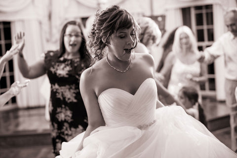 Hailey Judges dancing on her wedding day, image in black and white.