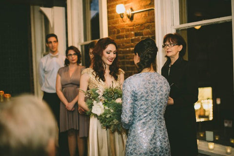 2020 Wedding Trend Report: Kaitlin and Stephanie’s Gastown wedding in New York, held at an intimate bar. bridesmaids are in Tender Taupe Sakura Midi Dresses