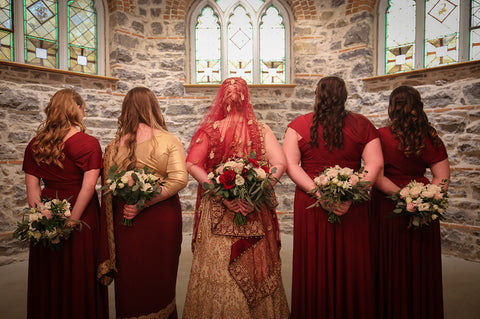 Stephanie Rochefort poses with her bridal party who are wearing Henkaa Burgundy Wine Sakura Maxi Infinity Dresses, made in Canada.
