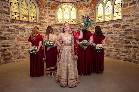 Stephanie Rochefort poses for portraits with her bridal party at allsaints Event Space in Ottawa Ontario, Canada, wearing Henkaa convertible dresses.