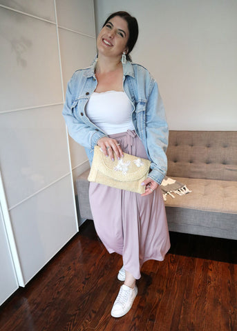 Madeleine Villa styles the Henkaa Ivy Midi as a skirt and accesorizes with a vintage straw clutch, Levi's denim jacket, and white tube top.