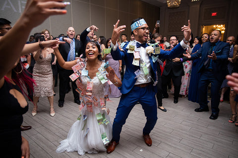 Kristina and Remar dance together during their Money Dance, while their guest dance around them.