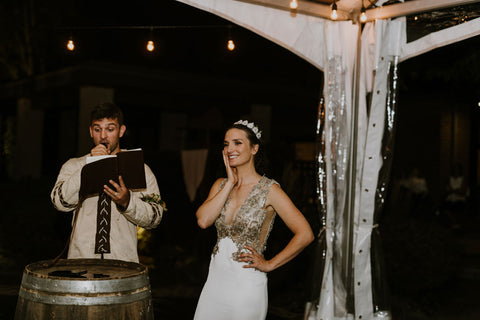 Wife, Lauren Melnik blushes as husband Alex Melnik sings his speech -a special rendition of 'Drops of Jupiter' to his new wife.