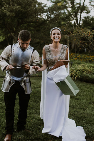 Lauren and Alex Melnik exchange medieval themed gifts during their tasteful middle-ages themed wedding featured on the Henkaa blog.